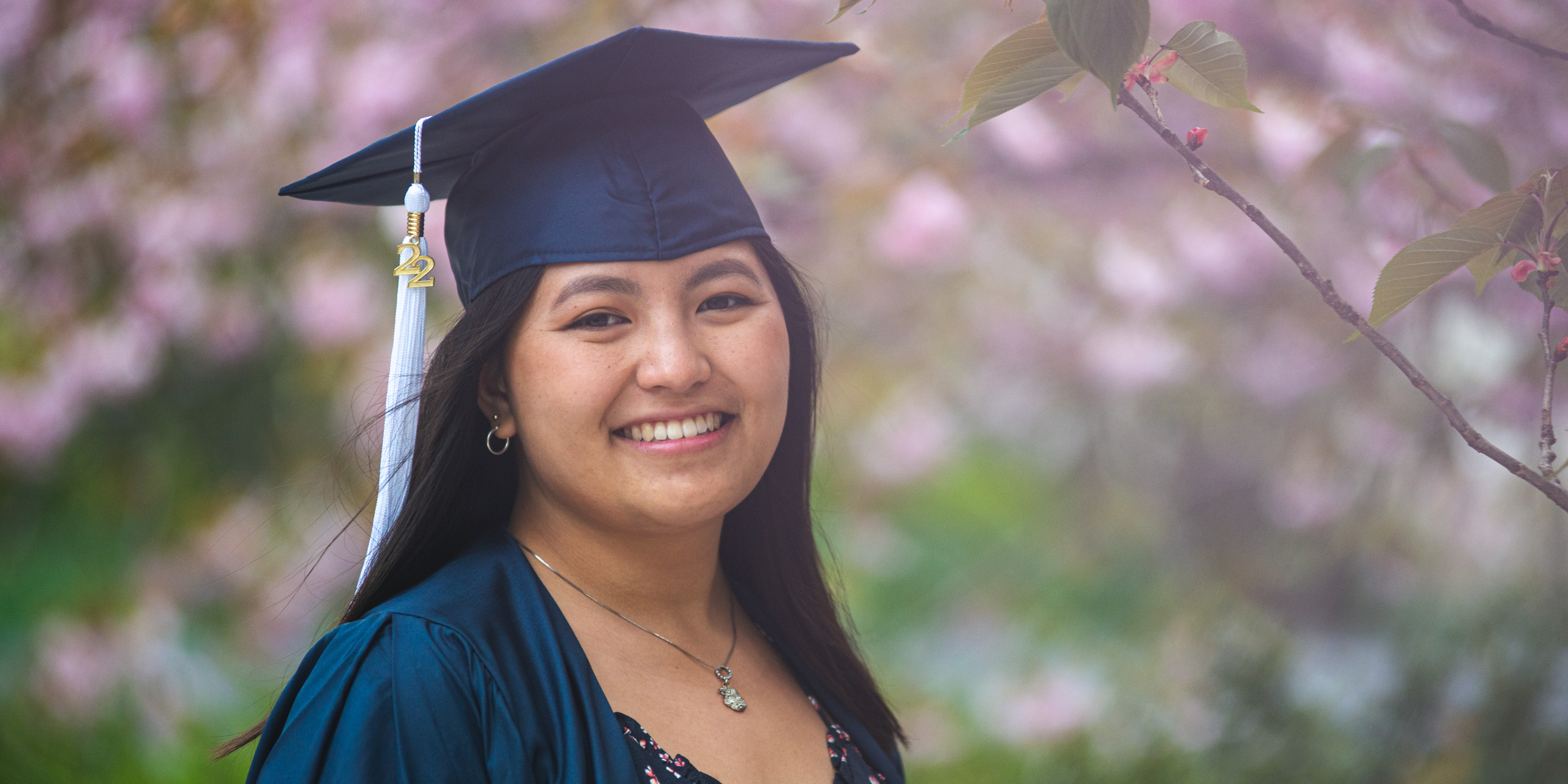 Penn State student wearing graduation cap and gown