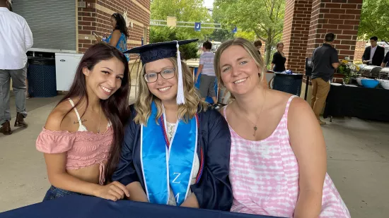 Jona Hall poses with two friends.