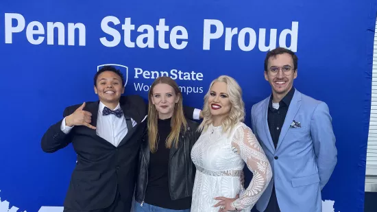 From left, Mona Hill, Sabrina Smith, Ariel Hinojos, and Daniel Serfass pose for a photo at the graduation celebration.