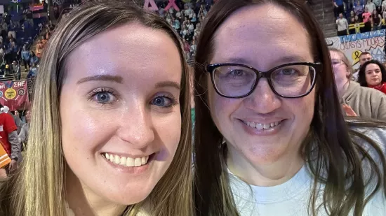 Two women pose for a selfie.