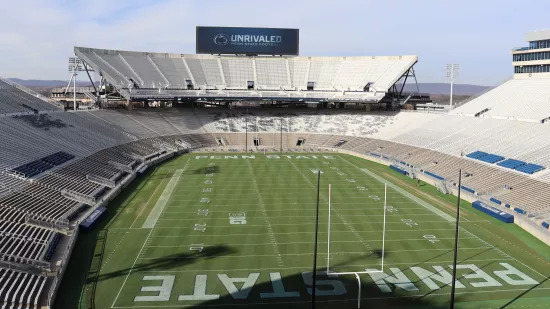 A football field and empty stadium.