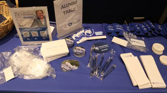 Notepads, stickers and papers lay on a blue-colored table.